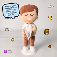 BibleBoy is the adorable plush boy doll that speaks 36 Bible verses. Holds his Bible with magnets in his hands and in the Bible. Wholesome dress. Clean cut hairstyle. Perfect baptism gift idea for Christian boys. From Jesusdoll.com.